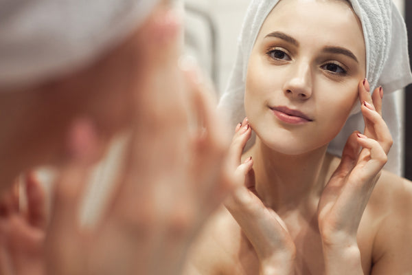 Young woman applying Skincare treatment