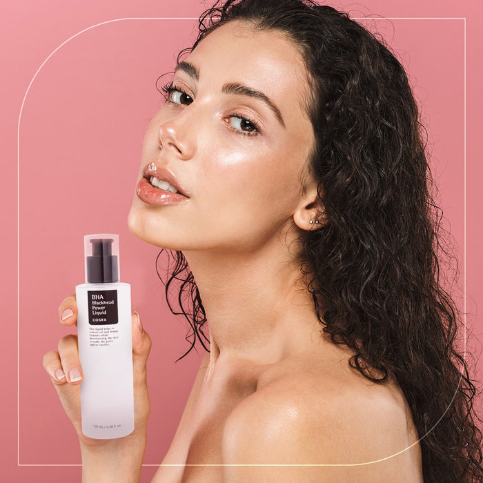 A Woman Holding a BHA Blackhead Power Liquid