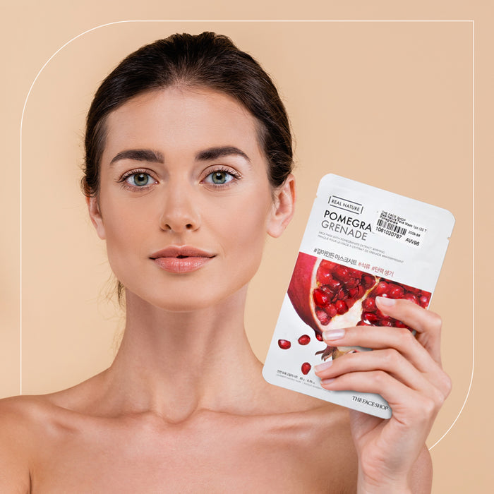 A woman holing a real nature pomegranate face mask
