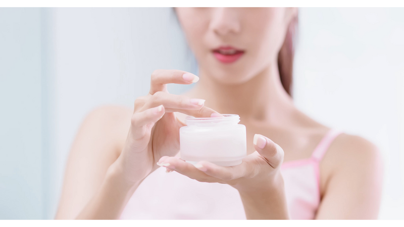 woman holding a moisturizer