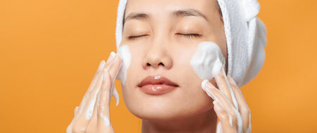 Woman Putting Cleansing Foam On Her Face
